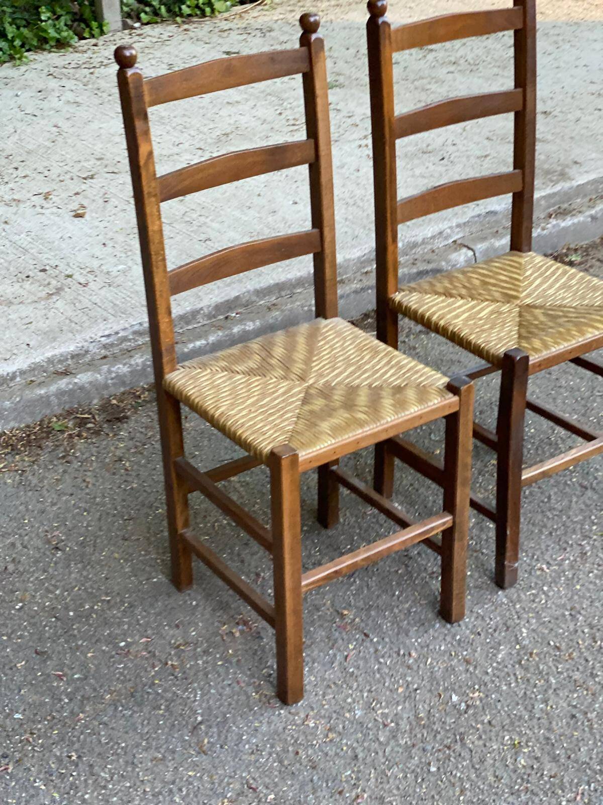 2 solid wood and straw chairs