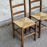 2 solid wood and straw chairs