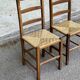 2 solid wood and straw chairs