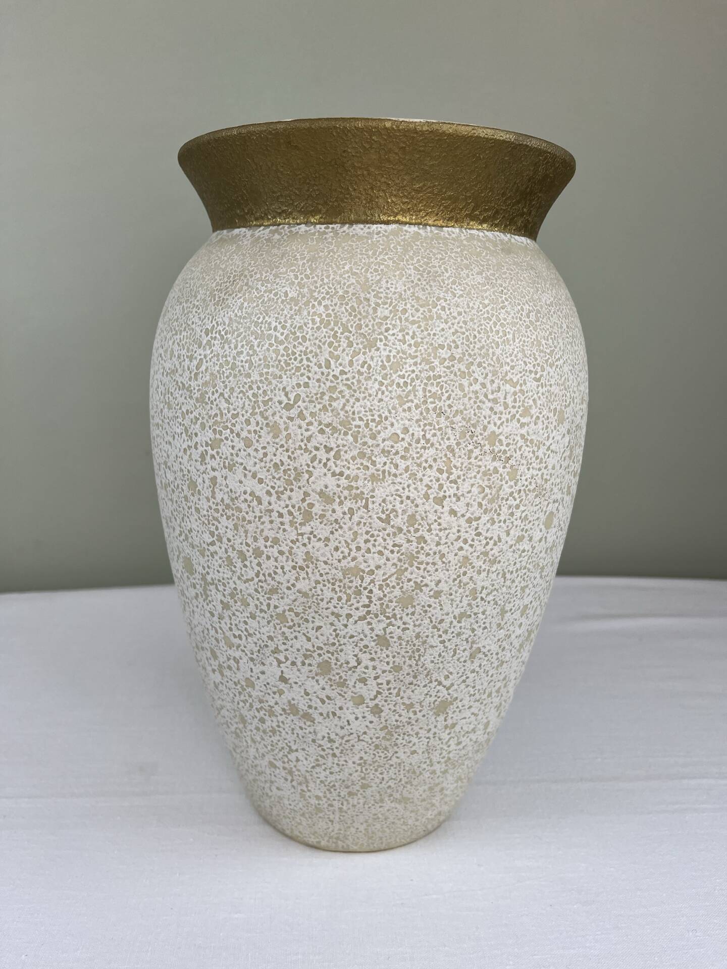 Cream speckled glazed vase with a gold rim, 1970s.