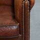 Fauteuil club en cuir de mouton couleur cognac
