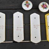 Set of 2 porcelain door handles and cleanliness plates