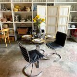 2 chairs in chromed metal and black woven skaï 1970s