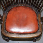 Antique English Edwardian captain's chair in oak by Ralph Johnson.