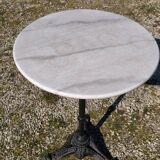 Marble bistro table with cast iron legs in Parisian café style