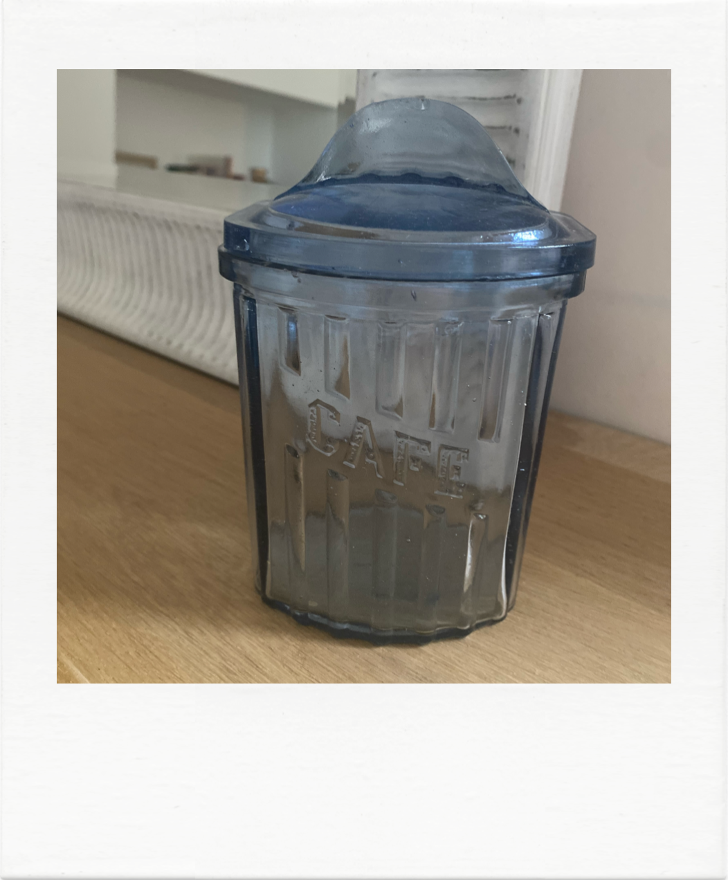 Old coffee pot in blue glass