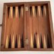 Old wooden chess set with a folding wooden box.