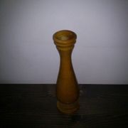 Brown wooden vase from the 1940s, turned, with an elongated silhouette and moulded base.