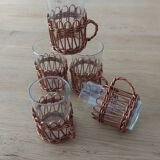 5 glasses with wicker surround