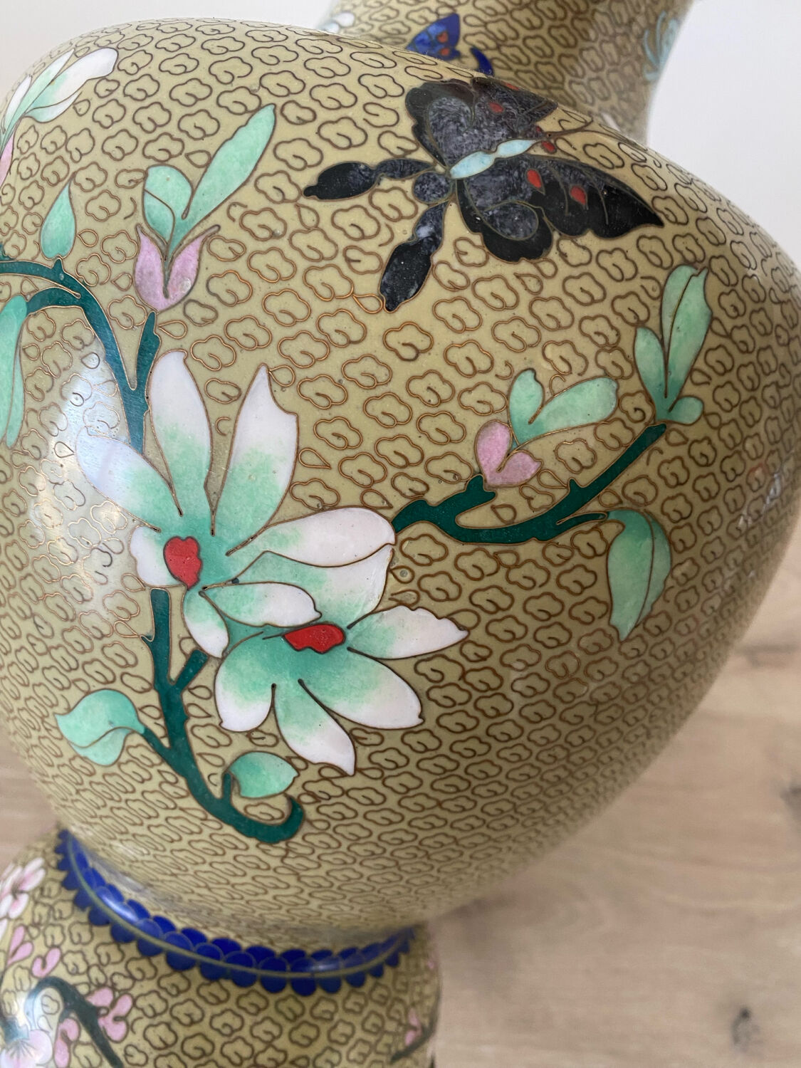 Chinese cloisonné vase decorated with flowers and butterflies.