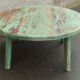 Round coffee table in old green wood