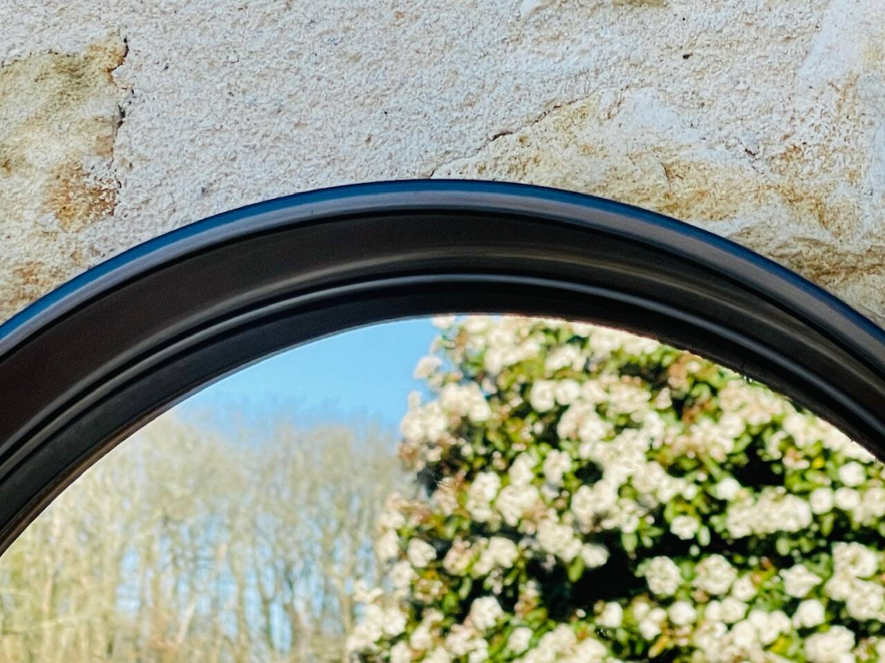 Vintage round smoked plastic mirror, circa 1970s.