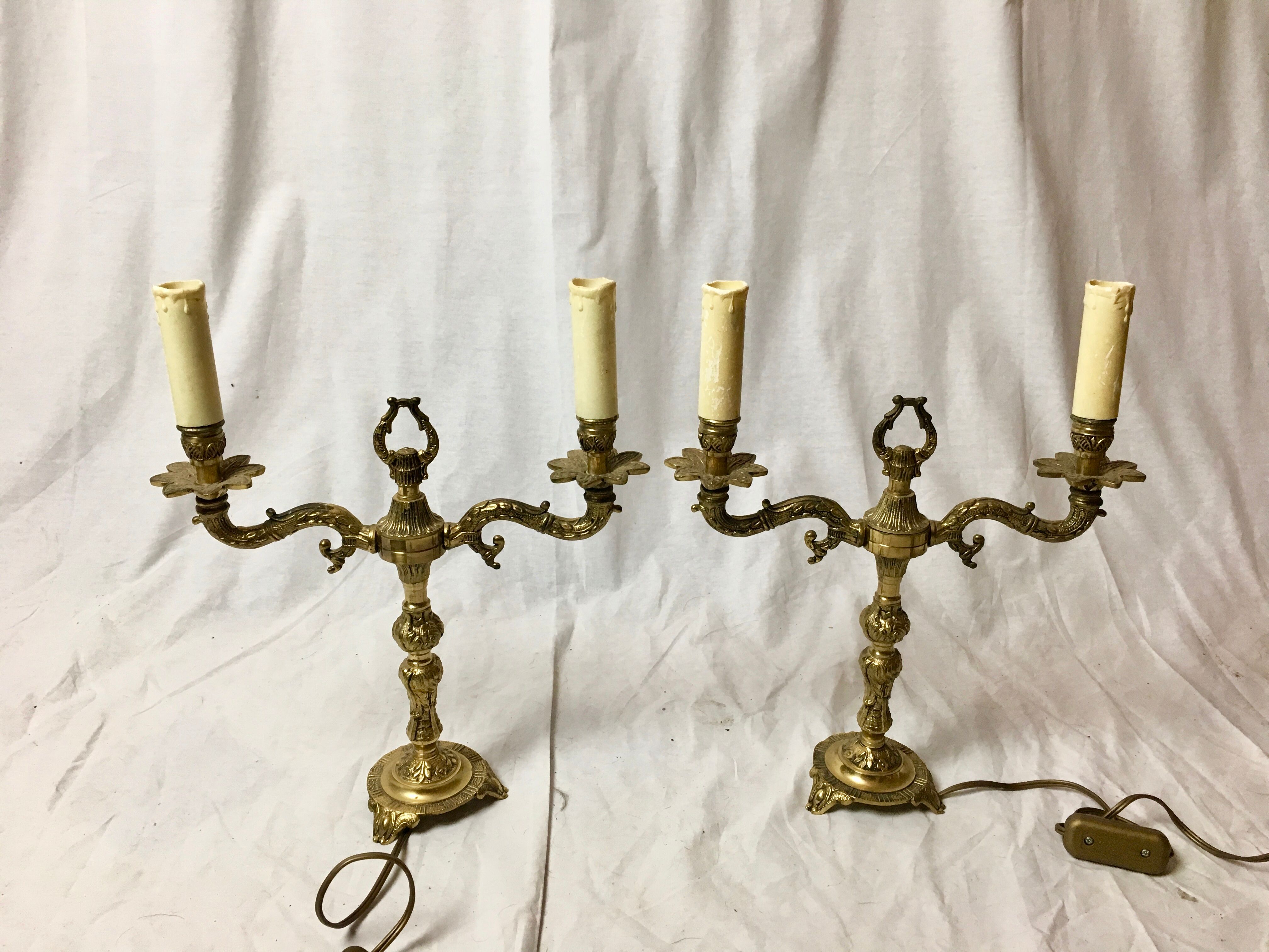 Pair of Louis XVI style double lamps in gilded bronze