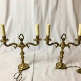 Pair of Louis XVI style double lamps in gilded bronze