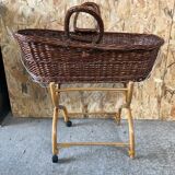 Old woven wicker baby cradle