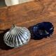 Vintage silver-plated shell butter dish with blue bowl.