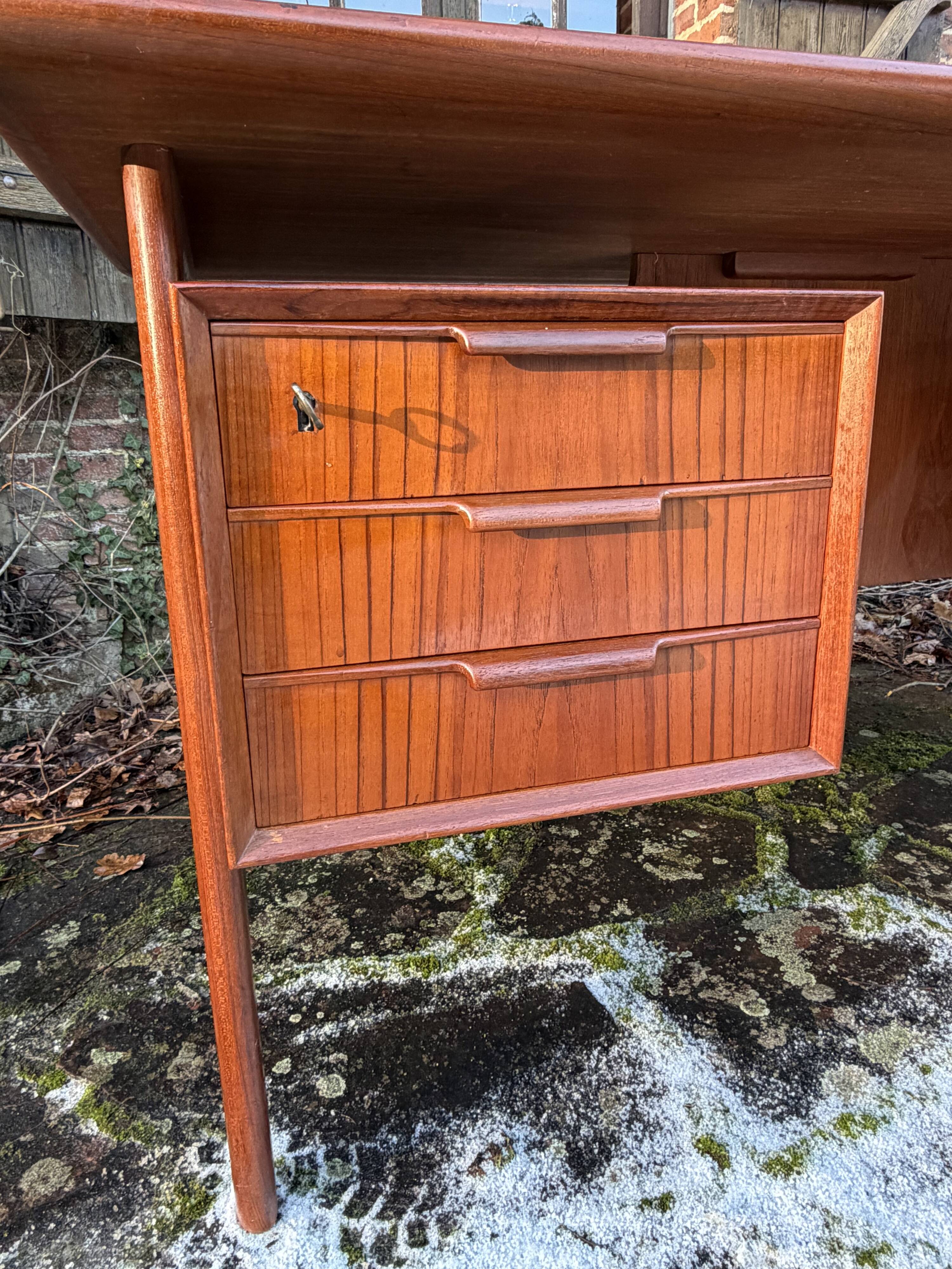 Danish teak desk Gunni Omann no. 75 from the 1960s.