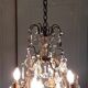 Louis XV-style bronze cage and crystal Baccarat chandelier