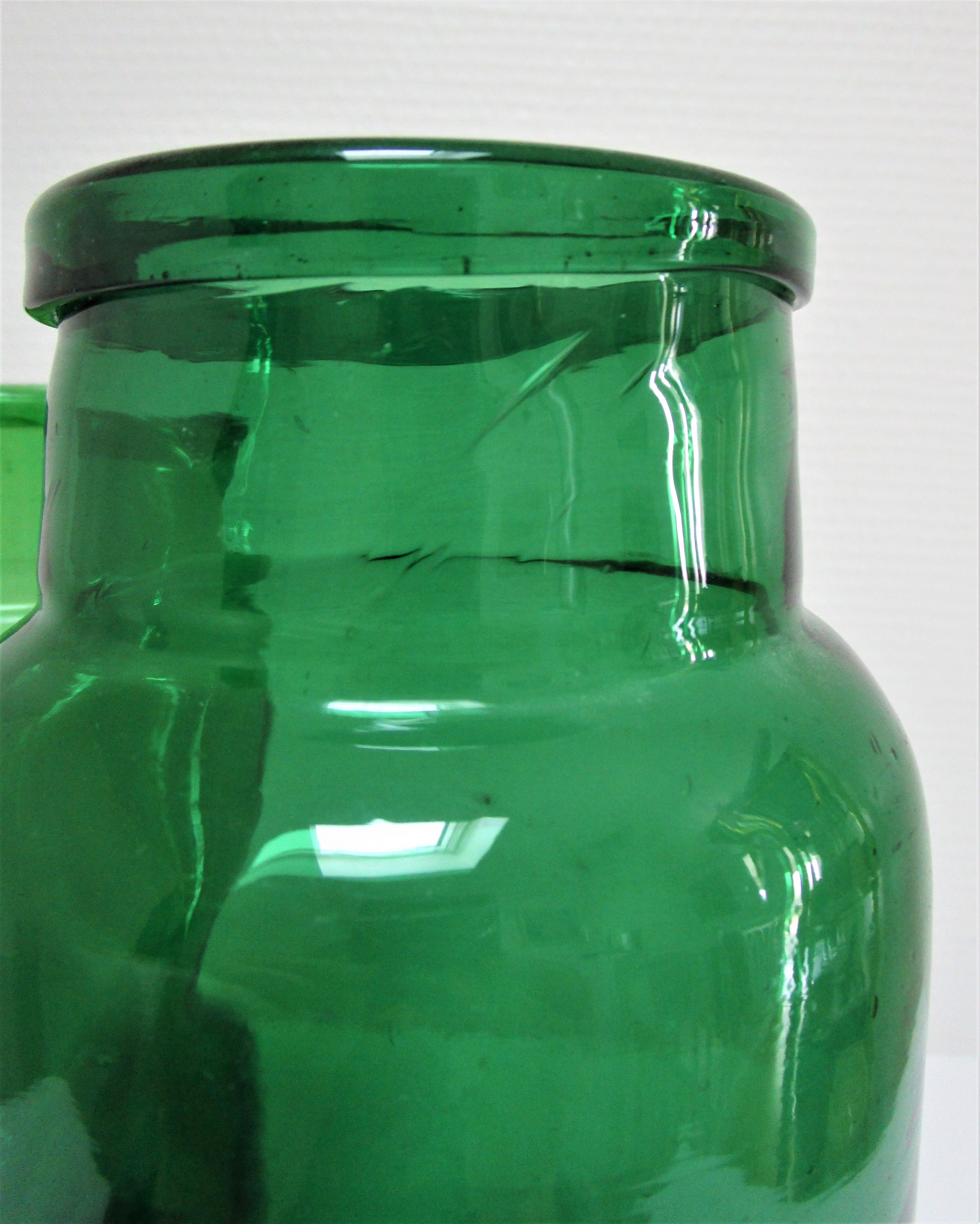 Two old green blown glass jars early 20th century