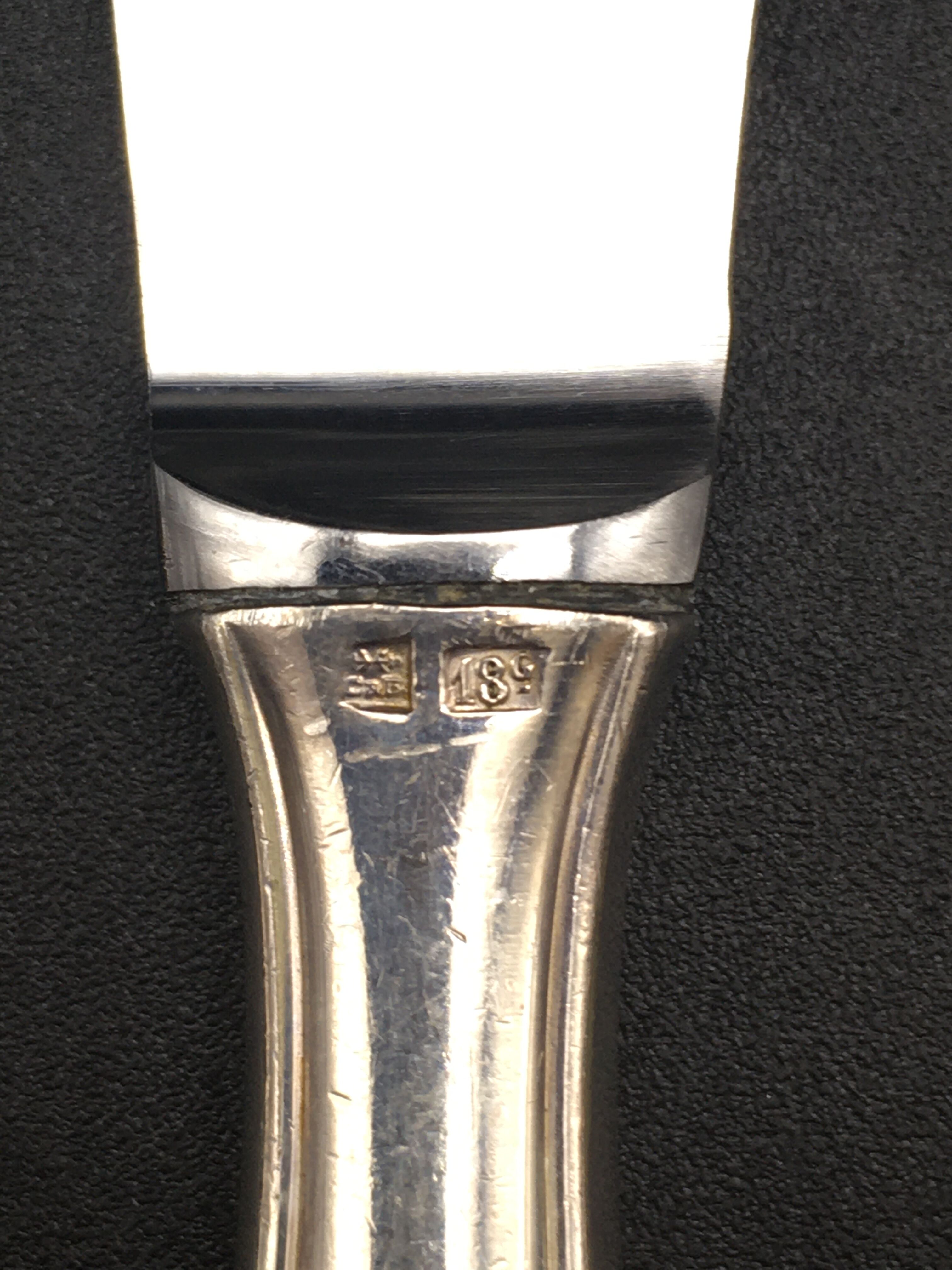 12 silver metal knives