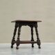 Rustic stool or side table in turned and carved solid oak, 19th century.
