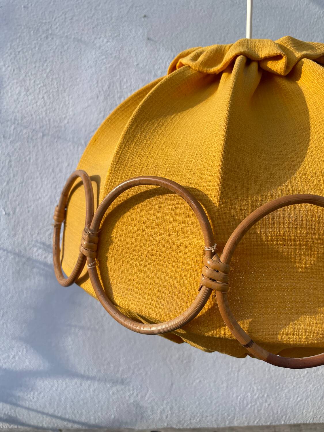 Wooden rattan and fabric suspension