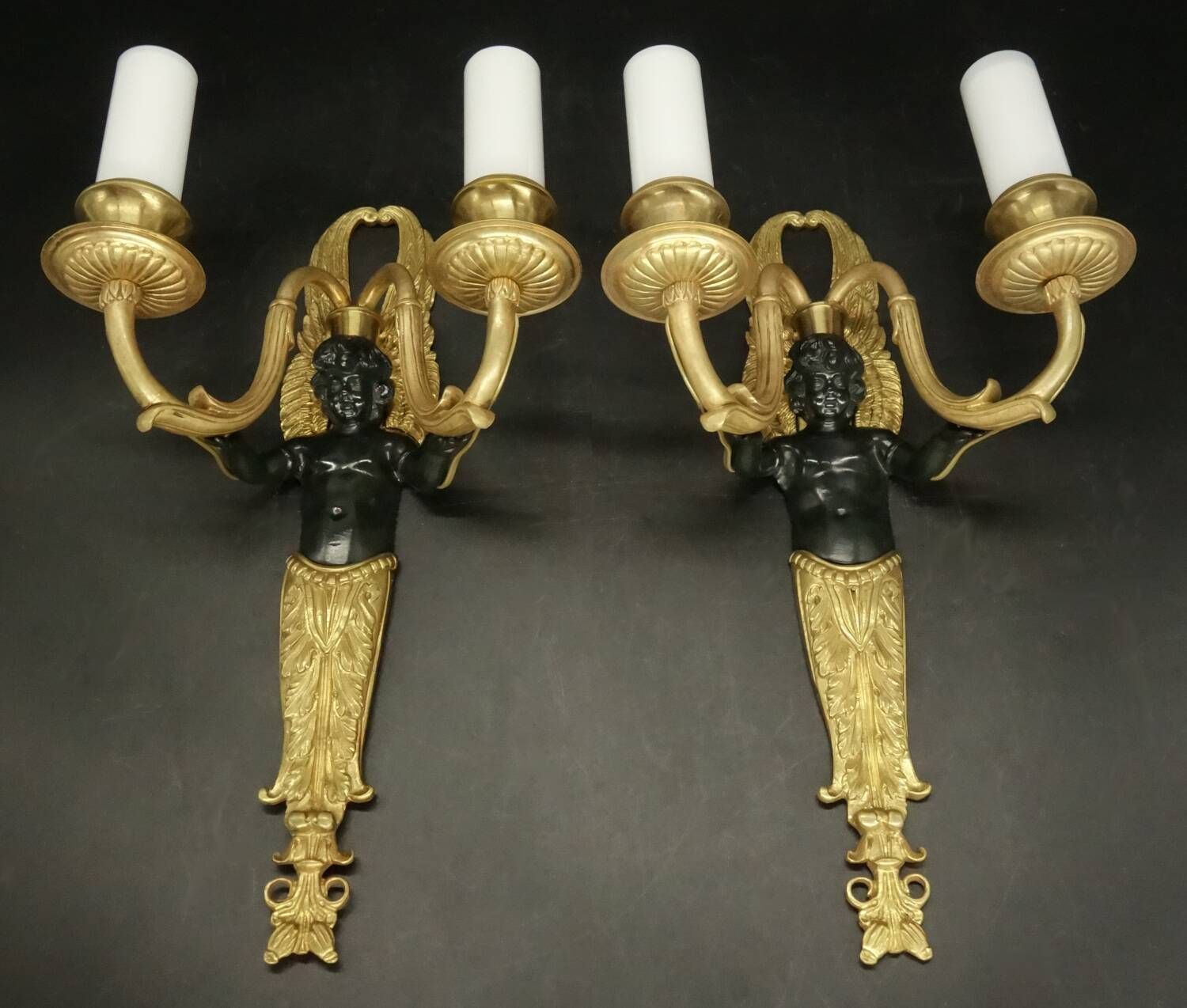 Pair of winged putti wall sconces in Louis XVI style - gilded bronze and black patina
