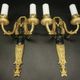 Pair of winged putti wall sconces in Louis XVI style - gilded bronze and black patina