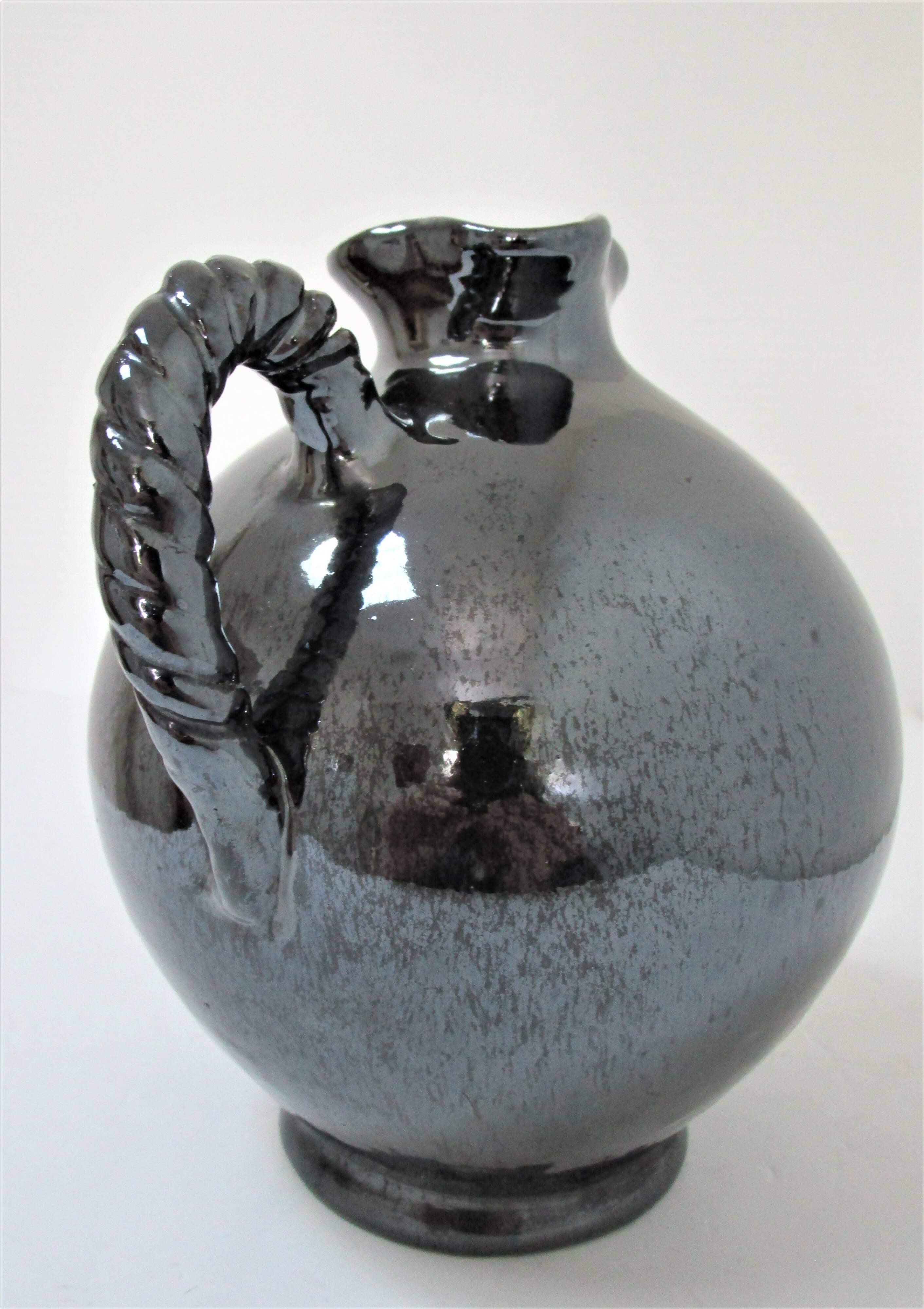 Black pearl glaze ceramic pitcher by Reinhold Rieckmann signed