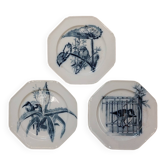 Set of three ironstone plates decorated with birds.