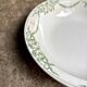 Round, deep Creil & Montereau dish in green earthenware, "Napoleon" service