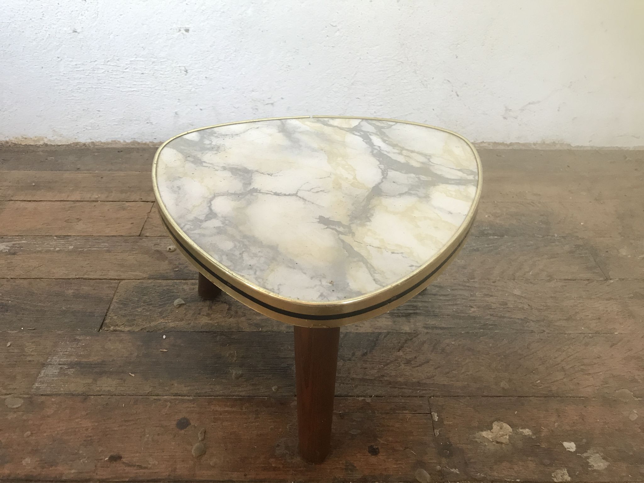 Small triangular table coffee table with a vintage tripod door midcentury plant 1950