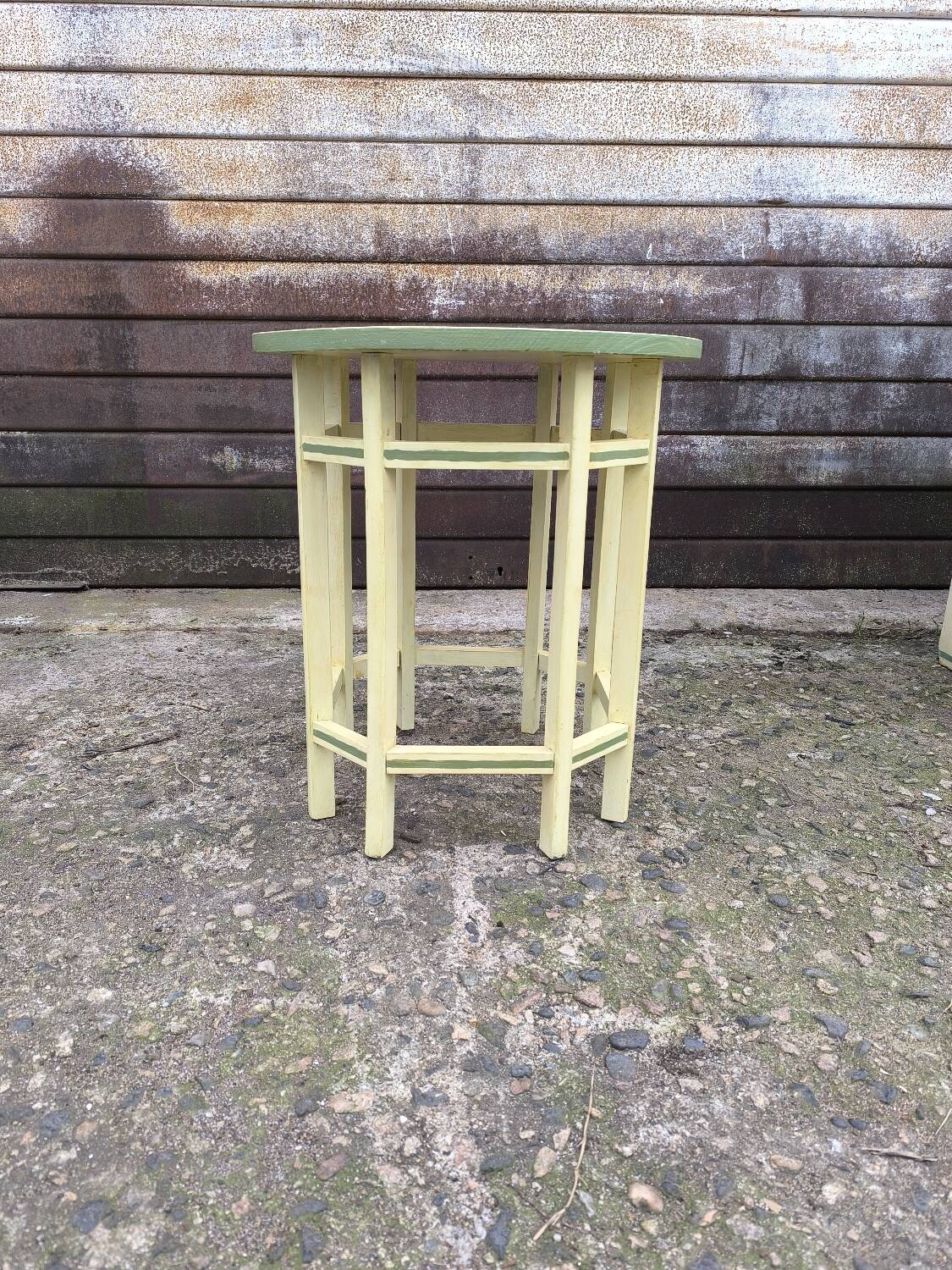 Yellow and green patinated pedestal table by a local artist