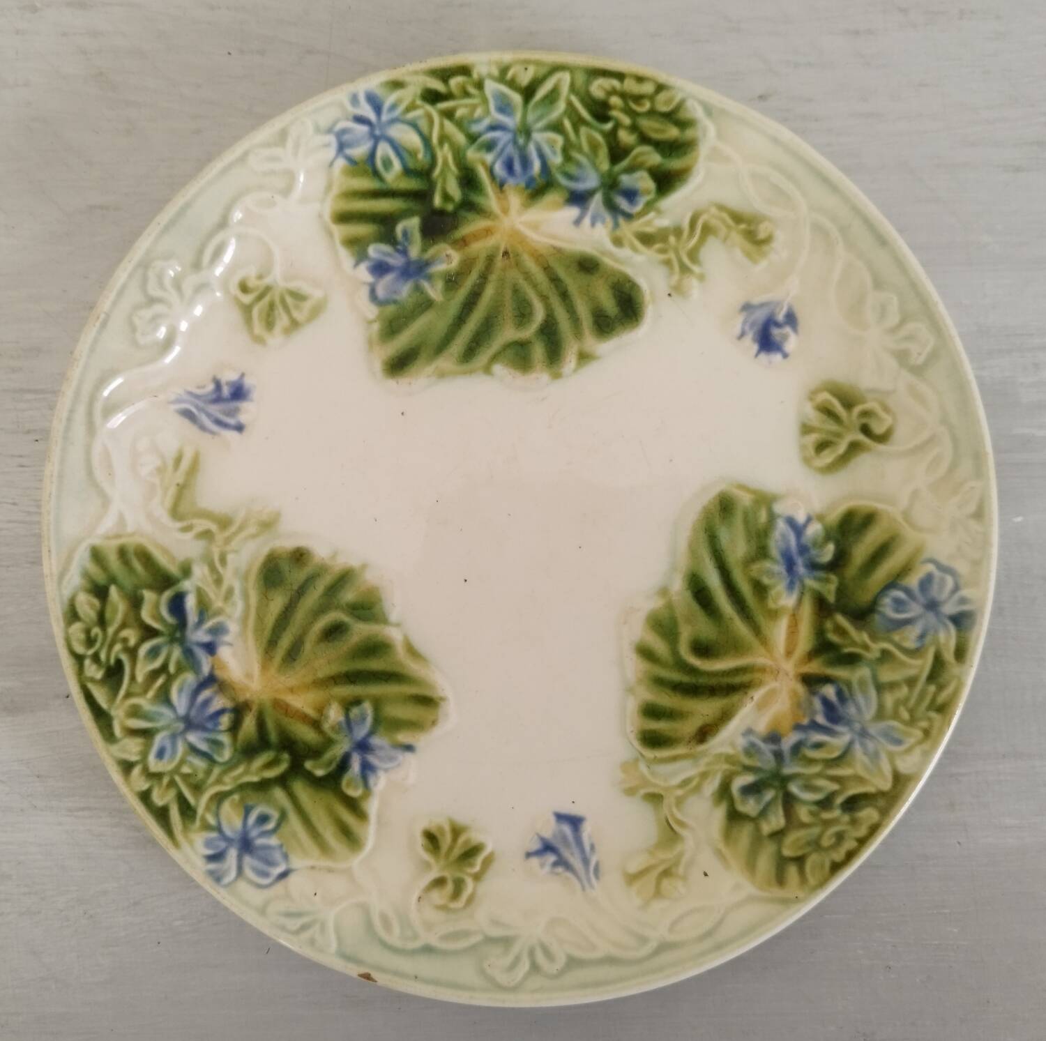 Antique Barbotine Plate Floral Decor and Green Foliage