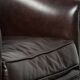 Dark cow leather club armchair with a stylish design in English style