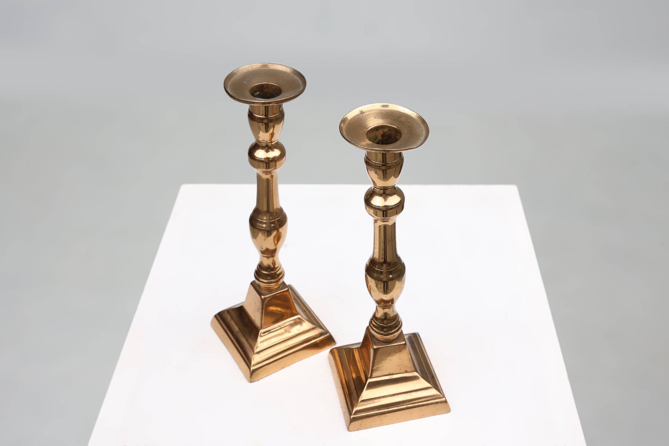 Pair of two French antique candlesticks in bronze, ca. 1890