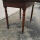 Table ronde à volets noyer