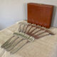 Art Deco oyster forks in punched silver metal, leatherette box