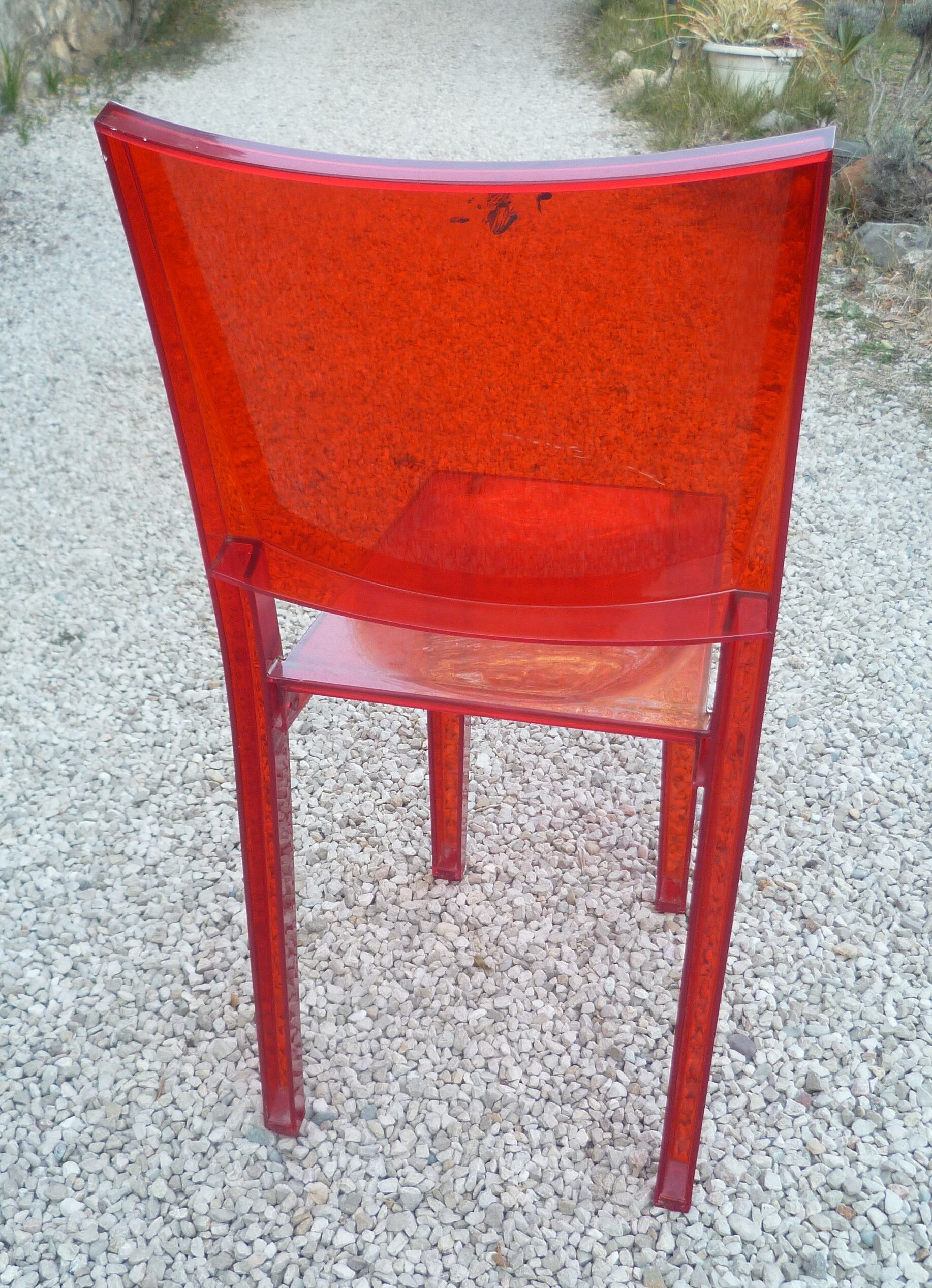 Orange design chair in polycarbonate plexiglass