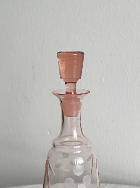 Antique translucent pink glass bottle