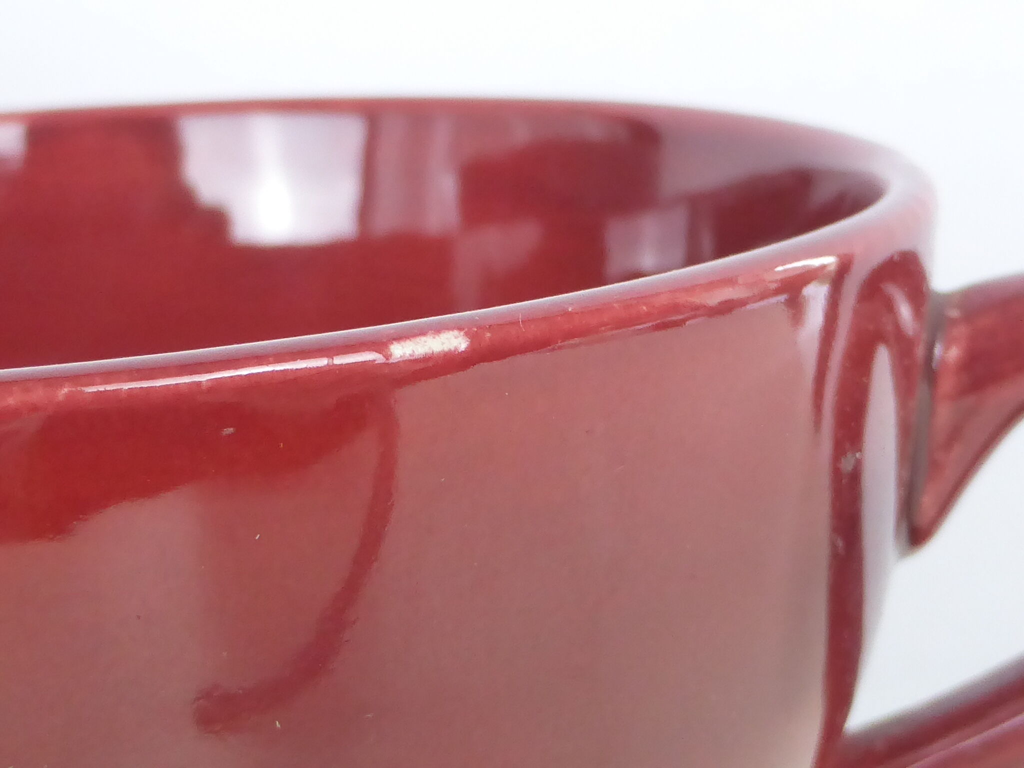 2 Old bowls with ox blood colored handle in St Clément earthenware