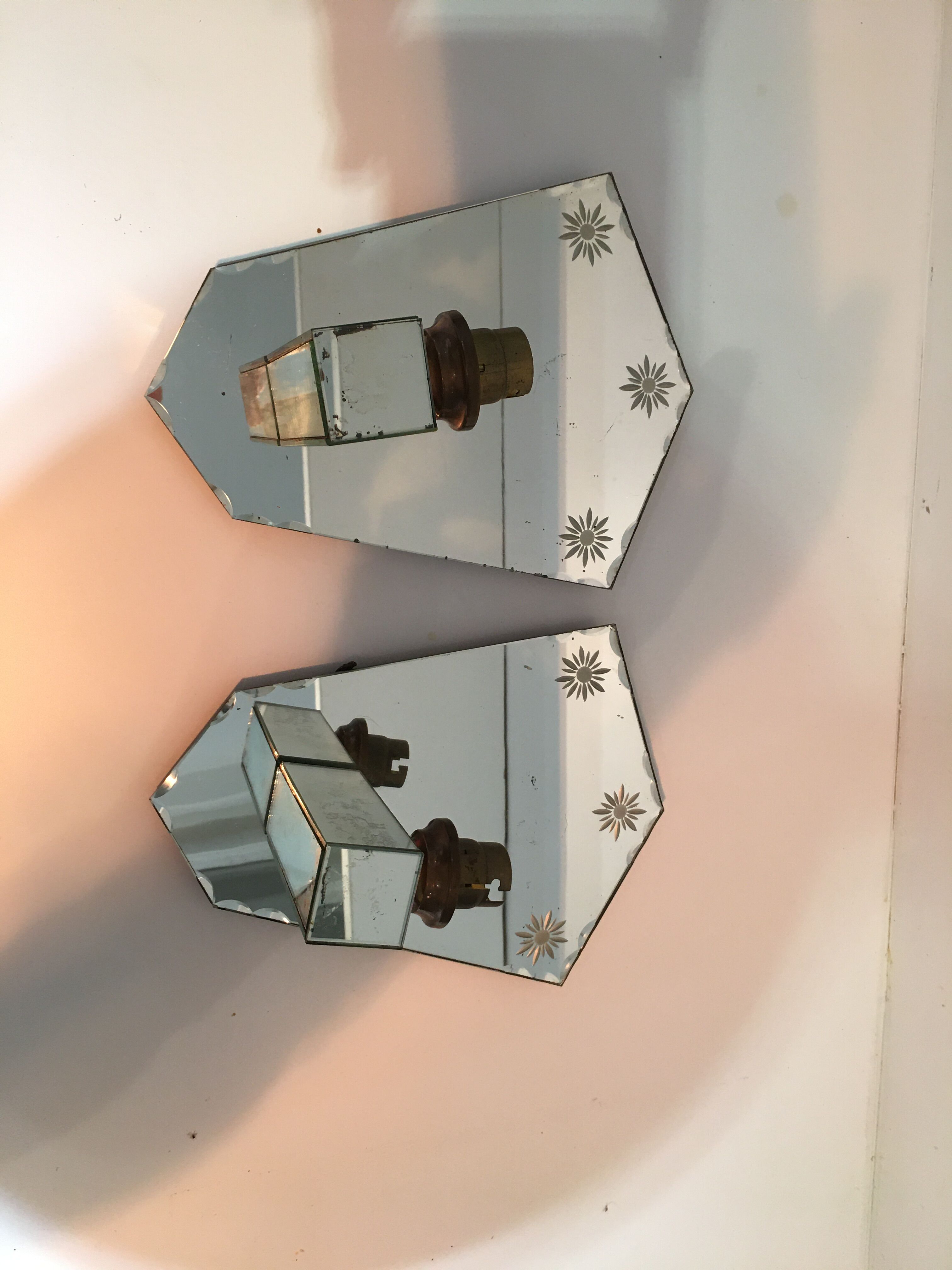 Pair of art deco sconces in venetian style mirror
