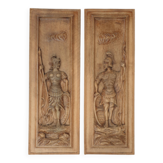 Pair of carved wooden bas-relief panels