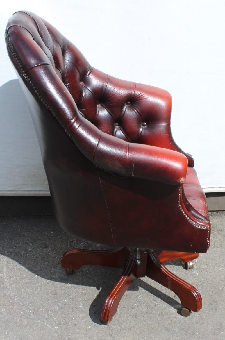 Oxblood leather bucket chair revolving