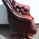 Oxblood leather bucket chair revolving