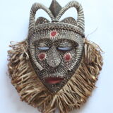 African mask with raffia and kaolin dots