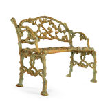 Green cast iron bench with green patina