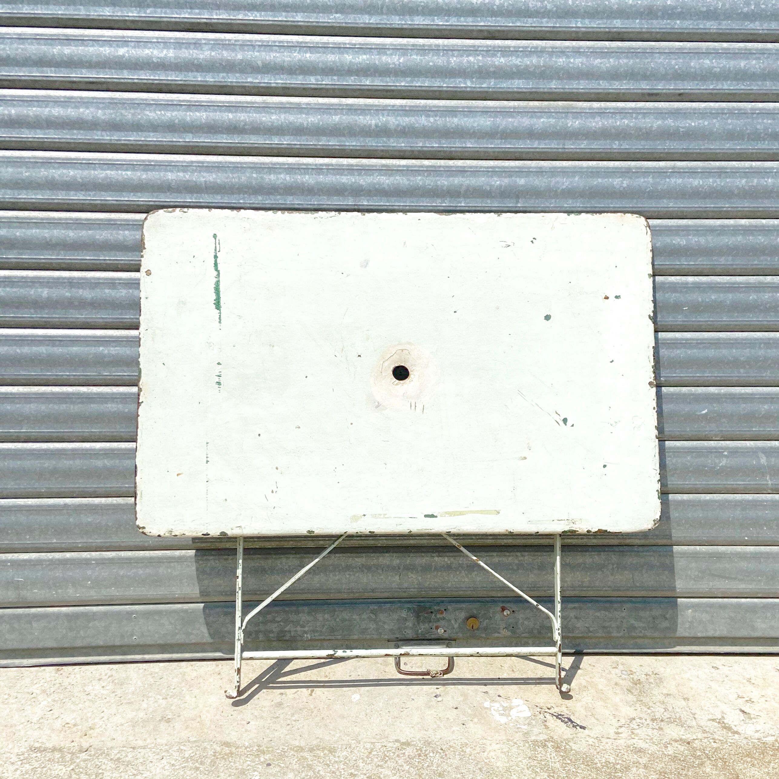 Old folding rectangular garden table - location for parassol