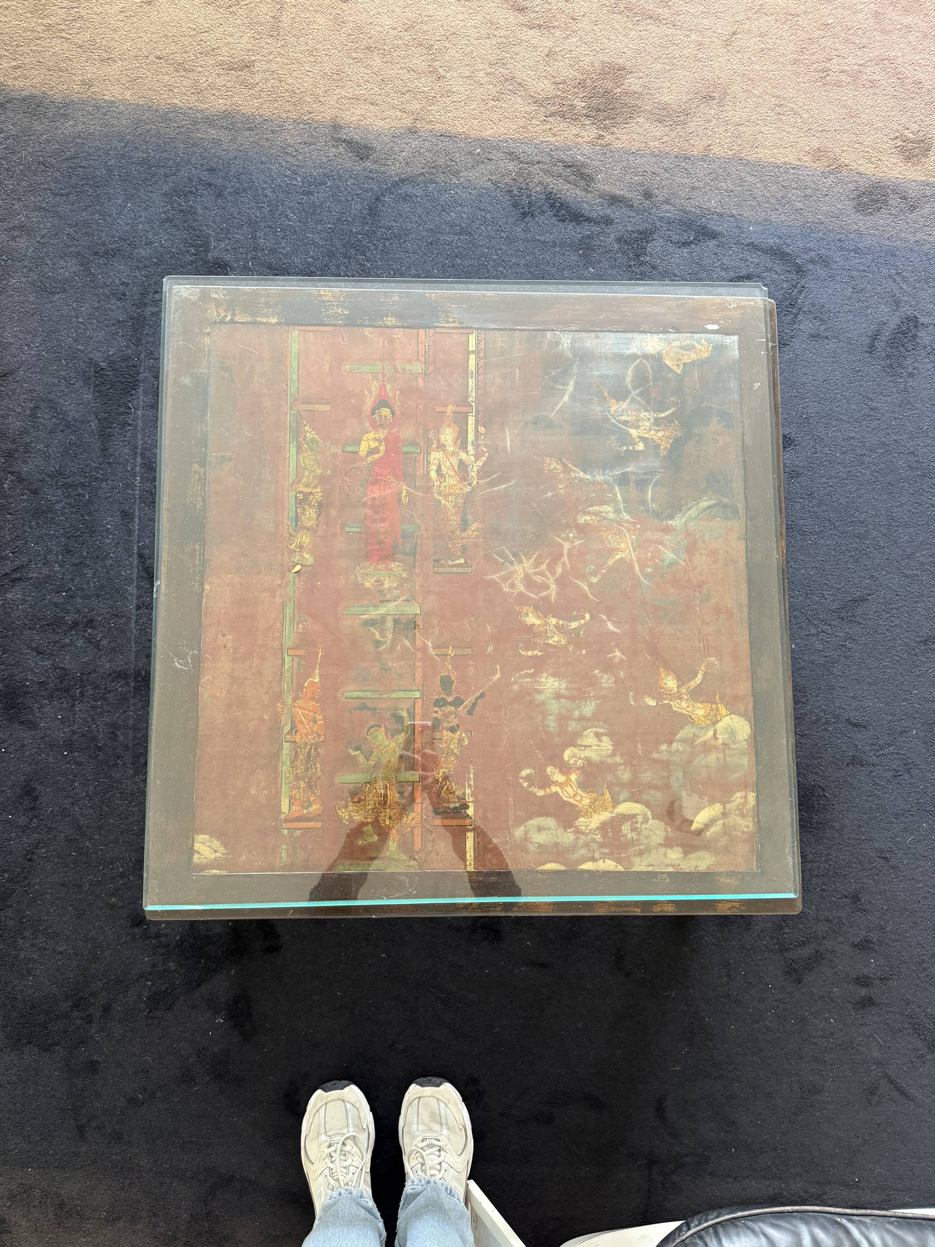 Vintage brutalist coffee table with Asian decor.