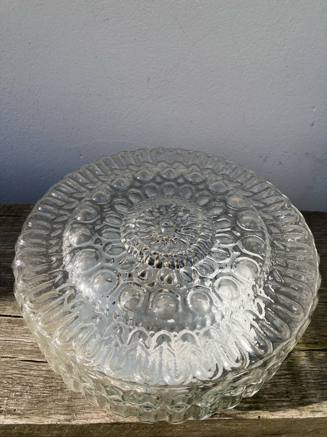 Pair of transparent round glass wall lights